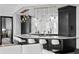 Modern kitchen features marble backsplash, custom cabinets and bar seating at 449 S 12Th St # 2702, Tampa, FL 33602