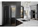 Modern kitchen includes a wine refrigerator, marble countertops, and elegant black fixtures at 449 S 12Th St # 2702, Tampa, FL 33602
