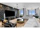 Elegant living room featuring modern design, textured wall, and floor-to-ceiling windows at 449 S 12Th St # 2702, Tampa, FL 33602
