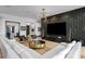 Living room showcasing modern decor, unique wall design, and comfortable white sectional couch at 449 S 12Th St # 2702, Tampa, FL 33602