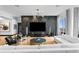 Living room with chic decor, large-screen TV, textured walls, and ample seating space at 449 S 12Th St # 2702, Tampa, FL 33602
