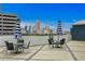 Enjoy outdoor dining with city views on this charming patio with table and chairs at 449 S 12Th St # 2702, Tampa, FL 33602