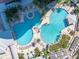 Resort-style condo pool with lush landscaping and ample lounge seating provide a relaxing oasis with beautiful outdoor spaces at 449 S 12Th St # 2702, Tampa, FL 33602
