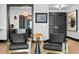 Sitting area features black leather chairs and a view of the wine cellar at 449 S 12Th St # 2702, Tampa, FL 33602