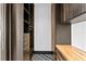 Organized walk-in closet with custom shelving and sleek black and white flooring at 449 S 12Th St # 2702, Tampa, FL 33602