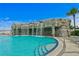 Beautiful waterfall feature cascading into the pool, creating a relaxing and tranquil atmosphere at 449 S 12Th St # 2702, Tampa, FL 33602