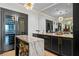 Custom wine cellar features a wine fridge and marble countertops at 449 S 12Th St # 2702, Tampa, FL 33602