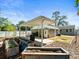 The backyard features a covered patio, raised garden beds and ample space for outdoor activities at 470 Hibiscus N Ln, Dunedin, FL 34698