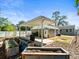 Spacious backyard with garden beds and covered patio at 470 Hibiscus N Ln, Dunedin, FL 34698