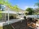 Backyard patio, gardening beds, and landscaping at 470 Hibiscus N Ln, Dunedin, FL 34698
