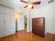 Bedroom with built-in closet and hardwood floors at 470 Hibiscus N Ln, Dunedin, FL 34698
