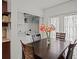 Dining area provides room for table and chairs and offers a view of a laundry area at 470 Hibiscus N Ln, Dunedin, FL 34698