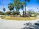 Well-maintained home with a manicured lawn, landscaping and mature trees in a desirable neighborhood at 470 Hibiscus N Ln, Dunedin, FL 34698
