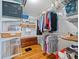 Spacious walk-in closet with custom shelving and room for storage at 470 Hibiscus N Ln, Dunedin, FL 34698