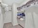 A well-organized closet with shelving, perfect for optimal storage at 5456 Logan Cave Ave, Wimauma, FL 33598
