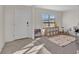 Welcoming foyer featuring neutral tile floors, a ' area, and plenty of natural light at 5456 Logan Cave Ave, Wimauma, FL 33598