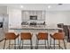 Stylish kitchen with stainless steel appliances, sleek countertops, and barstool seating at 5456 Logan Cave Ave, Wimauma, FL 33598
