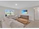 Inviting living room featuring a plush sofa, a wooden coffee table, and a flat-screen TV, perfect for relaxing at 5456 Logan Cave Ave, Wimauma, FL 33598