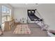 Spacious playroom with a carpeted floor, multiple toys, and a bright window at 5456 Logan Cave Ave, Wimauma, FL 33598