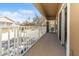 A spacious balcony with white railing overlooks the community with seating at 7001 Interbay Blvd # 181, Tampa, FL 33616