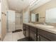 A bathroom featuring double sinks, tile flooring, and a shower/tub combo at 7001 Interbay Blvd # 181, Tampa, FL 33616