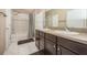 A bathroom featuring double sinks, tile flooring, and a shower/tub combo at 7001 Interbay Blvd # 181, Tampa, FL 33616