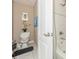 Compact bathroom featuring decorative touches and a shower/tub combination at 7001 Interbay Blvd # 181, Tampa, FL 33616