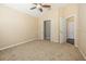 Bedroom with neutral carpet, a ceiling fan, and a closet at 7001 Interbay Blvd # 181, Tampa, FL 33616