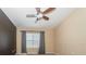 Bedroom with neutral carpet, large window, and ceiling fan at 7001 Interbay Blvd # 181, Tampa, FL 33616