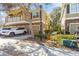 Inviting two-story townhome featuring a balcony, a one-car garage and a beautifully landscaped front yard at 7001 Interbay Blvd # 181, Tampa, FL 33616