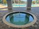 Hot tub with brick surround and water feature, located near the community pool at 7001 Interbay Blvd # 181, Tampa, FL 33616