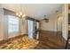 Spacious living room featuring hardwood floors, elegant lighting, and large windows at 7001 Interbay Blvd # 181, Tampa, FL 33616