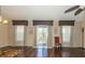 Living area with hardwood floors, large windows, and access to a balcony at 7001 Interbay Blvd # 181, Tampa, FL 33616