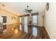 Spacious living room with hardwood floors, decorative ceiling fan, and large windows with custom drapes at 7001 Interbay Blvd # 181, Tampa, FL 33616