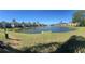 Scenic pond with a fountain and beautiful landscaping, surrounded by community homes at 7001 Interbay Blvd # 181, Tampa, FL 33616
