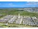 This aerial view features a well-planned community near the water, set amidst lush greenery and natural beauty at 704 Winterside Dr, Apollo Beach, FL 33572
