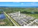 An aerial view highlights a neighborhood with scenic water views and a beautifully designed community layout at 704 Winterside Dr, Apollo Beach, FL 33572