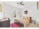 Cozy bedroom featuring a comfortable bed, neutral decor, and ample natural light at 704 Winterside Dr, Apollo Beach, FL 33572