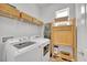 Bright Laundry room with Washer, Dryer, Storage, and Window at 704 Winterside Dr, Apollo Beach, FL 33572