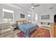 Serene main bedroom featuring plush carpet, a ceiling fan, and ensuite bathroom access at 704 Winterside Dr, Apollo Beach, FL 33572