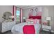 Bright bedroom featuring flamingo-themed decor and ample natural light with view to the outdoors at 757 Steel Dr, Apollo Beach, FL 33572