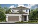 Charming two-story home with neutral siding, a two-car garage, and manicured landscaping at 757 Steel Dr, Apollo Beach, FL 33572