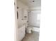 Bright bathroom with a vanity, toilet, and a shower-tub with white tile surround and updated fixtures at 8728 Mallard Reserve Dr # 102, Tampa, FL 33614