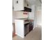 Modern kitchen with a breakfast bar, stainless steel dishwasher, and ample cabinet space at 8728 Mallard Reserve Dr # 102, Tampa, FL 33614