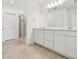 Bathroom features double vanity, framed mirrors and tile flooring at 10356 Cross River Trl, Parrish, FL 34219
