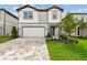Charming two-story home with landscaped yard and paved driveway at 10356 Cross River Trl, Parrish, FL 34219