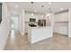 Contemporary kitchen featuring white cabinets, island, and stainless steel appliances at 10356 Cross River Trl, Parrish, FL 34219