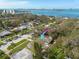 Aerial view of a charming community with water views and tree-lined streets near the bay at 1044 Charles St, Clearwater, FL 33755