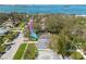 Aerial view of a residential neighborhood close to the bay, with lush trees and well-maintained lawns at 1044 Charles St, Clearwater, FL 33755
