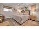 Comfortable bedroom featuring wood-look floors, ceiling fan, and neutral decor at 1044 Charles St, Clearwater, FL 33755